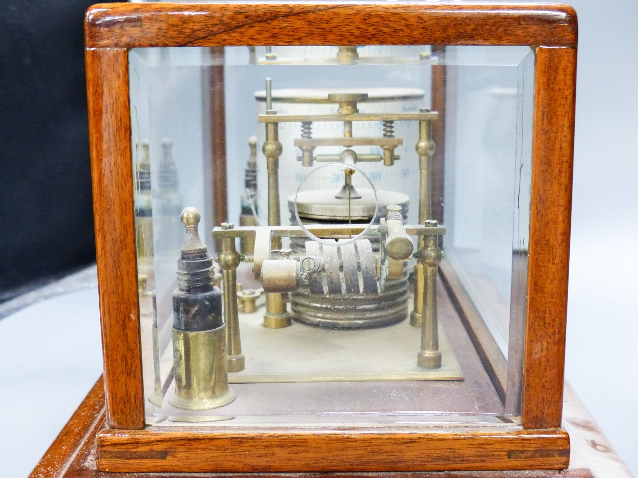 A mahogany cased barograph by Negretti & Zambra No C.13658 with spare graph paper in drawer 37cm